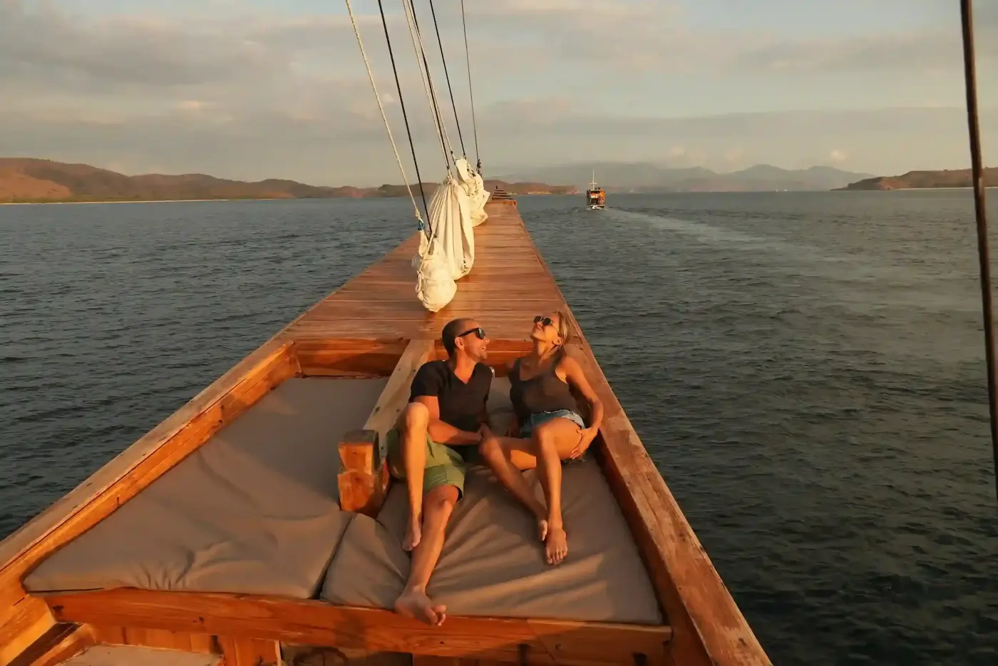 Guests relaxing on the bow of a phinisi