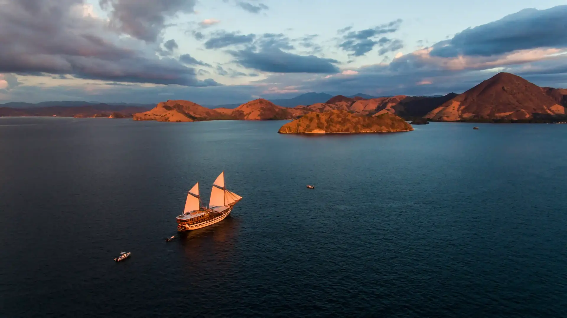 Aerial view of a phinisi among the islands of Komodo
